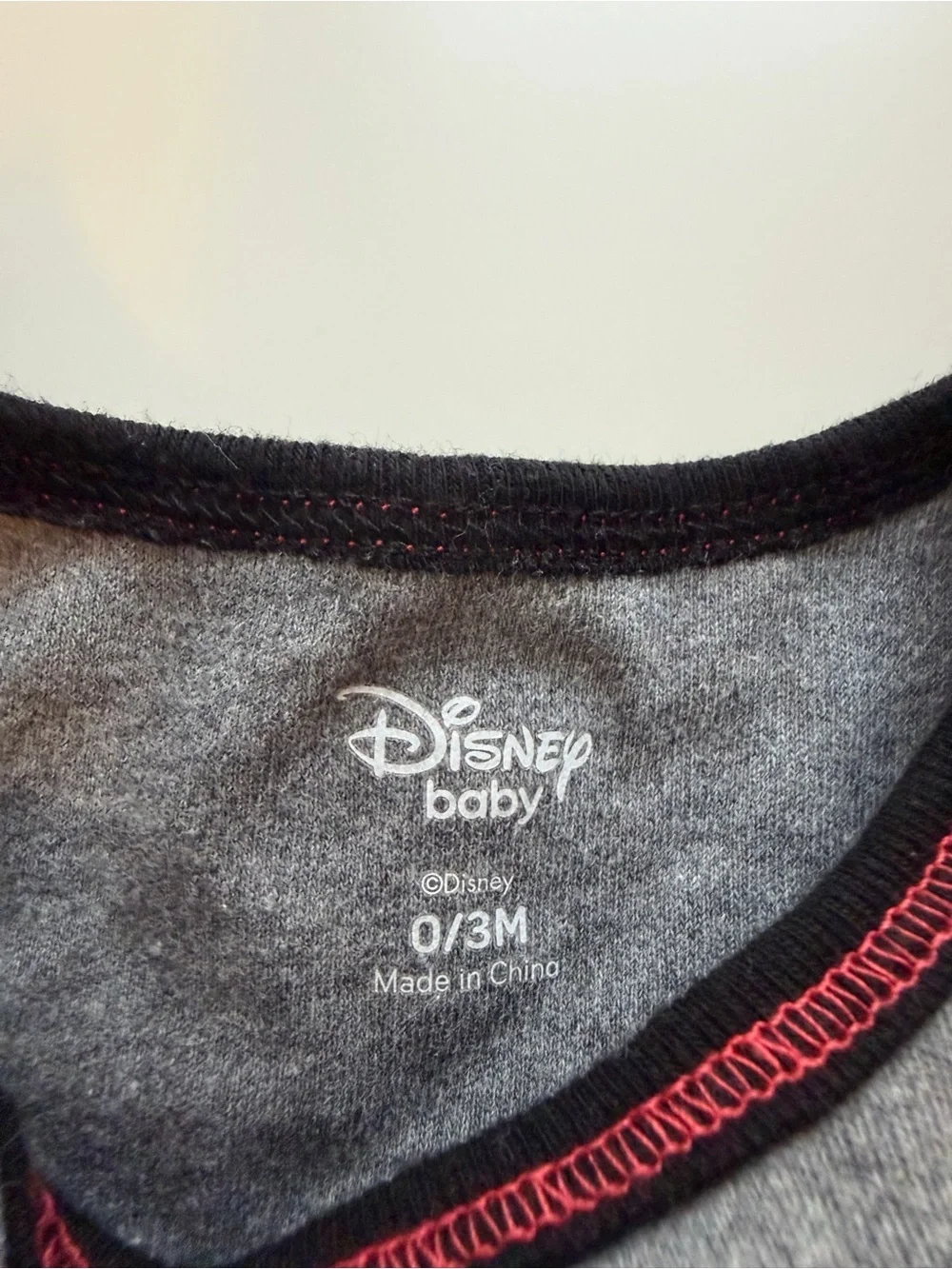 Disney Gray Mickey Mouse Graphic One-Piece with Yellow, Red and Black Accents